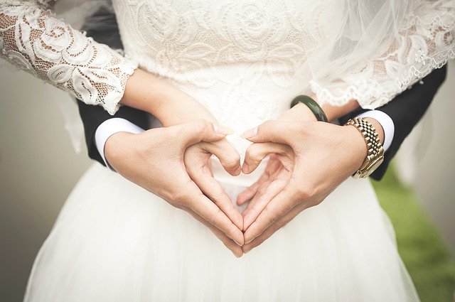 hands in marriage shaping a heart